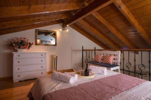 Postel nebo postele na pokoji v ubytování Aris Cosy Casa