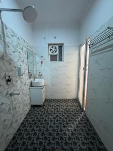 a bathroom with a toilet and a sink and a shower at GreenDay Escapes Rishikesh in Rishīkesh