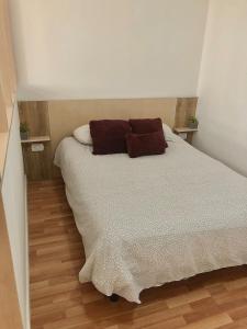 Ένα ή περισσότερα κρεβάτια σε δωμάτιο στο Oliva 8