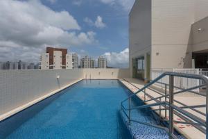 a swimming pool on the roof of a building at Comfort Hotel Santos in Santos