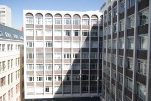 a view of a tall building with many windows at senator park in Cape Town