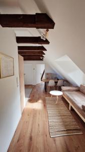 a living room with a couch and a table at Central apartment in Buchholz idN in Buchholz in der Nordheide
