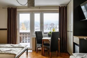 Postel nebo postele na pokoji v ubytování Pokoje Gościnne CYKADA