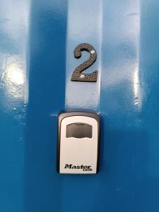 a button with a number two on a blue door at La Martinna 2 in Trinidad