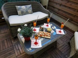 a table with food and drinks on a patio at BUENOS AYRES 45 in Chiavari