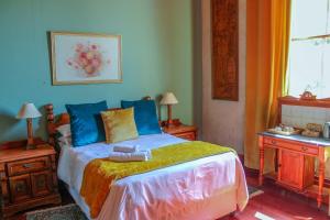 A bed or beds in a room at The Fountain Villa
