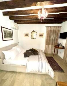Postel nebo postele na pokoji v ubytování B&B Fortuny