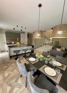 a kitchen and living room with a table and chairs at Villa Perla in Mošćenička Draga