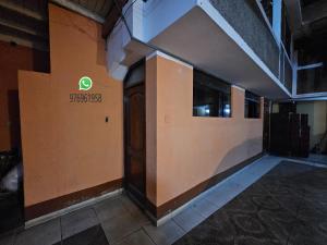 a building with a sign on the side of it at HOSPEDAJE ALVARADO - DOBLE - 101 - Bueno Bonito y Barato in Cajamarca +4 photos