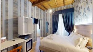 Postel nebo postele na pokoji v ubytování ROME'S GLORIA HOTEL