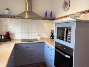 Kuchyň nebo kuchyňský kout v ubytování Villa Blanc