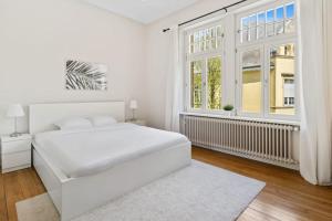 Rúm í herbergi á Spacious & Tranquil Rooms in Limpertsberg