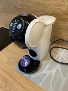 a hair dryer sitting on top of a table at Apartment AMBER in Brocēni +3 photos