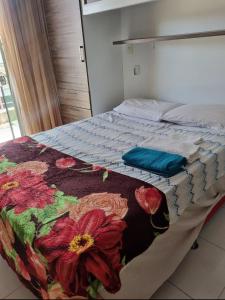 Una cama o camas en una habitación de Suíte confortável