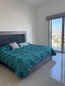 Ένα ή περισσότερα κρεβάτια σε δωμάτιο στο Faava Departamentos +20 φωτογραφίες