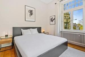 Rúm í herbergi á Spacious & Tranquil Rooms in Limpertsberg