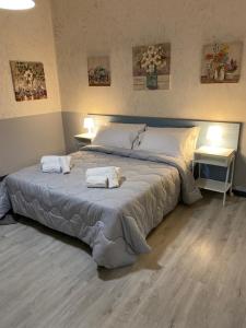 Postel nebo postele na pokoji v ubytování La casetta di Nina