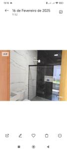 a screenshot of a bathroom with white marble at Edícula com churrasqueira in Foz do Iguaçu