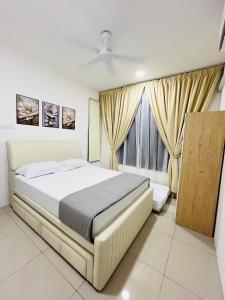 a bedroom with a large bed and a window at FA Homestay KLIA 2 in Nilai