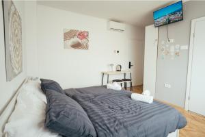 Krevet ili kreveti u jedinici u objektu Studio Apartment & Rooms Huang