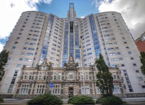 a large building with two tall buildings at 267 Stylish 2 Bed Apartment City Centre Free Parking in Cardiff