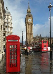 a red telephone booth in front of big ben at London Westfield Bedroom in London