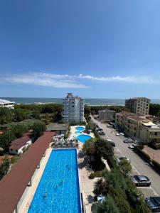 an overhead view of a swimming pool at a resort at Uno Due Tre Stella in Chioggia