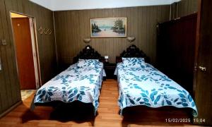 Ένα ή περισσότερα κρεβάτια σε δωμάτιο στο Hotel Di Maurier