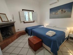 A bed or beds in a room at La Cecia - Casa vacanze nella campagna salentina