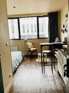 En eller flere senge i et værelse på Studio Tête d 'Or