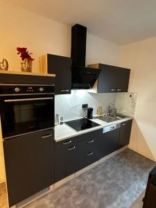 Η κουζίνα ή μικρή κουζίνα στο Beti Apartment 3