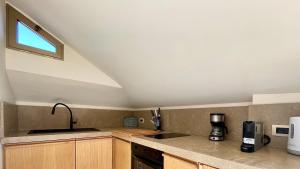 Cucina o angolo cottura di "La Casa da'Mare" un attico di charme vista mare
