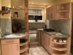 a kitchen with a sink and a stove top oven at Ferienwohnung "Tier-Garten" in Tribsees