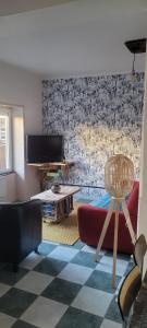 a living room with a couch and a table at L'aparté Champenoise in Beine-Nauroy