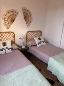 two beds sitting next to each other in a room at Apartmán se 2 ložnicemi in Isla del Fraile +26 photos