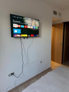 a flat screen tv hanging on a wall at Apartmán se 2 ložnicemi in Isla del Fraile