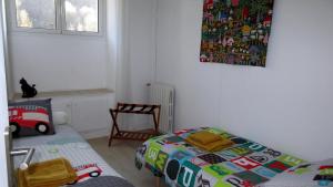 Posteľ alebo postele v izbe v ubytovaní Gîte le Marmare