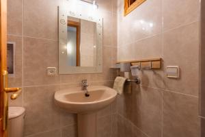 a bathroom with a sink and a mirror at Apartment Sol 2 in Port de Soller +12 photos