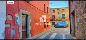 a blue van parked on a street in an alley at Calonge Ca la Noni in Calonge