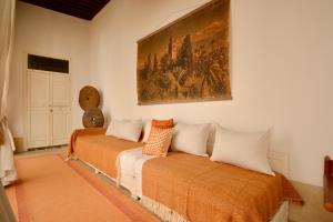 Voodi või voodid majutusasutuse Riad de charme toas