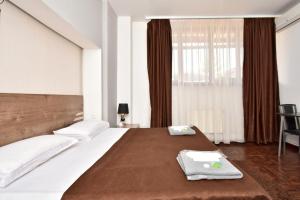 Postel nebo postele na pokoji v ubytování A&S hotel