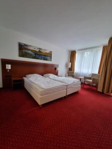 Postel nebo postele na pokoji v ubytování Hotel am Rosenpark + 37 fotografií