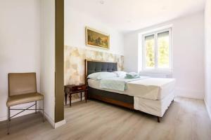 En eller flere senge i et værelse på Maison de Maître