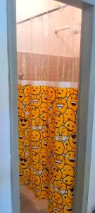 a glass door with a curtain with tigers on it at APARTAMENTO x 4 pessoas no VILLAGE DAIANE TAQUARY Guaibim Valença Bahia in Valença