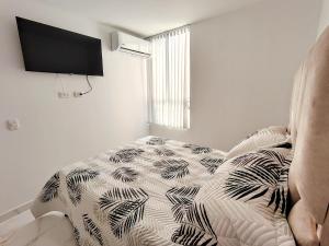 Postel nebo postele na pokoji v ubytování Apartamento en Girón sector colonial cerca del Aeropuerto + 26 fotografií