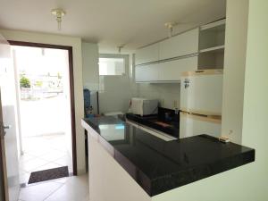 Η κουζίνα ή μικρή κουζίνα στο Apartamento em Jacumã - Edifício Mar & Sol Residence
