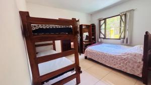 Postel nebo postele na pokoji v ubytování Casa Amarela na praia para 13 pessoas