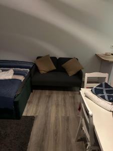 a room with a bed and a couch in it at Ferienwohnung Centro 2 in Bremerhaven