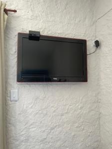 TV a/nebo společenská místnost v ubytování Suítes Maresia