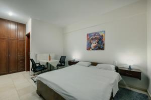 Postel nebo postele na pokoji v ubytování O Fotis Studios & Apartments